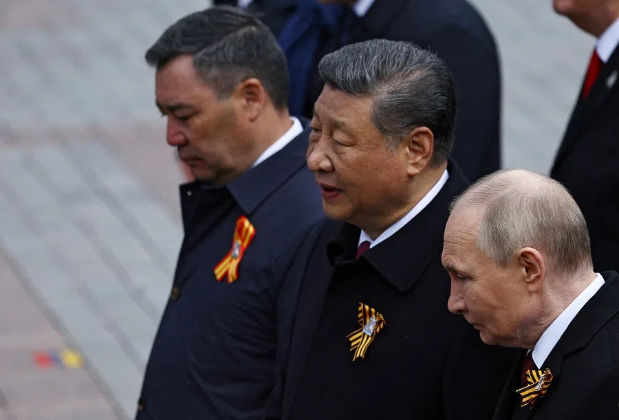 Russian President Vladimir Putin, Chinese President Xi Jinping and Kyrgyz President Sadyr Japarov attend a flower-laying ceremony at the Tomb of the Unknown Soldier on Victory Day, marking the 80th anniversary of the victory over Nazi Germany in World War Two, in central Moscow, Russia, on 9 May 2025. (Evgenia Novozhenina/Reuters)