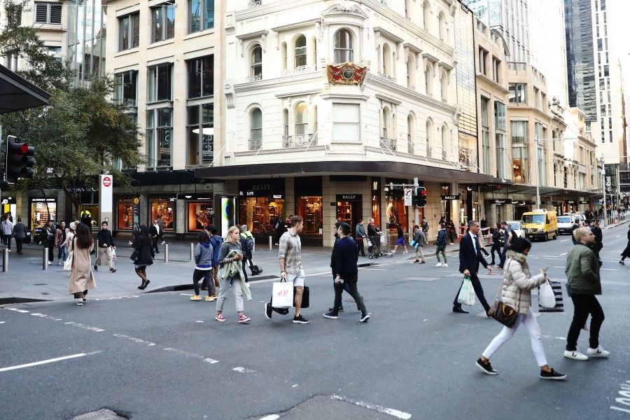 Pedestrians and shoppers cross a road at Pitt Street Mall in Sydney, Australia, on 3 June 2020. (Brendon Thorne/Bloomberg)
