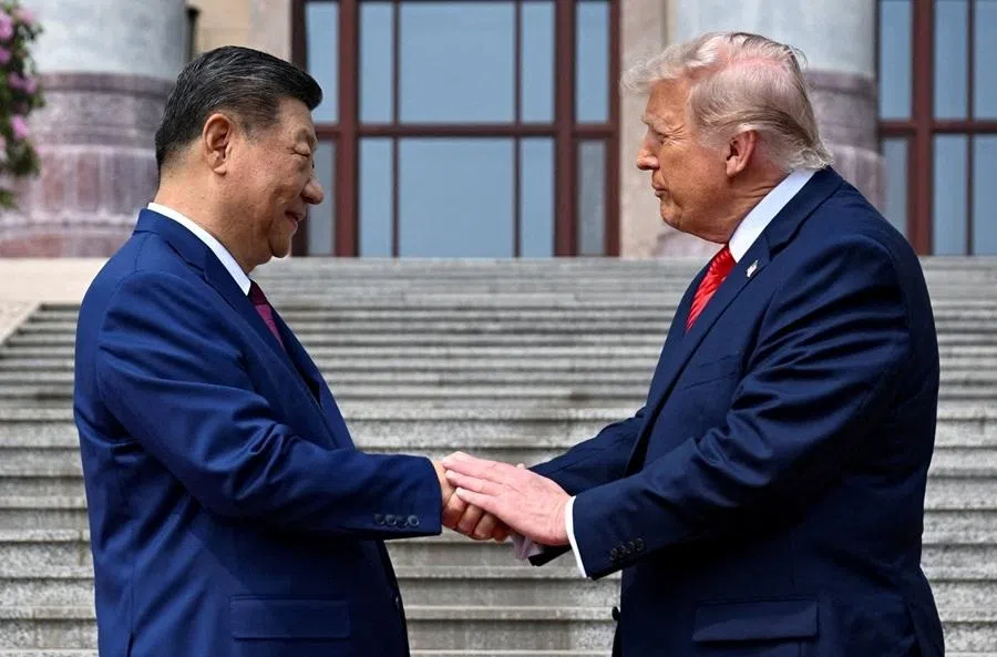 US President Donald Trump participates in events at the Great Hall of the People and does a greeting with Chinese President Xi Jinping, in Beijing, China, 14 May 2026. (Kenny Holston/Pool via Reuters)