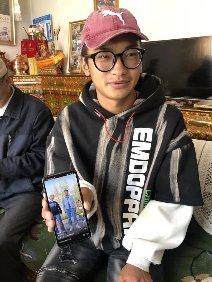 Danzeng Duoji, 20, showing me a dancing clip that he uploaded onto Douyin.