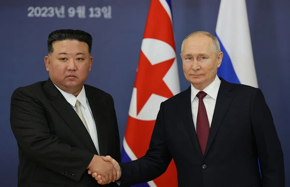 This pool image distributed by Sputnik agency shows Russian President Vladimir Putin (right) and North Korea's leader Kim Jong-un shaking hands during their meeting at the Vostochny Cosmodrome in Russia on 13 September 2023. (Vladimir Smirnov/Pool/AFP)