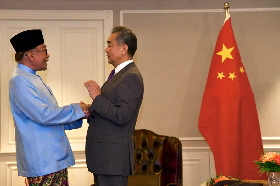 Malaysia Prime Minister Anwar Ibrahim speaks with Chinese Foreign Minister Wang Yi during the foreign minister's visit to Malaysia at Penang, Malaysia, 11 August 2023. (Prime Minister Office/Muhammad Faiz Norzani/Handout via Reuters)