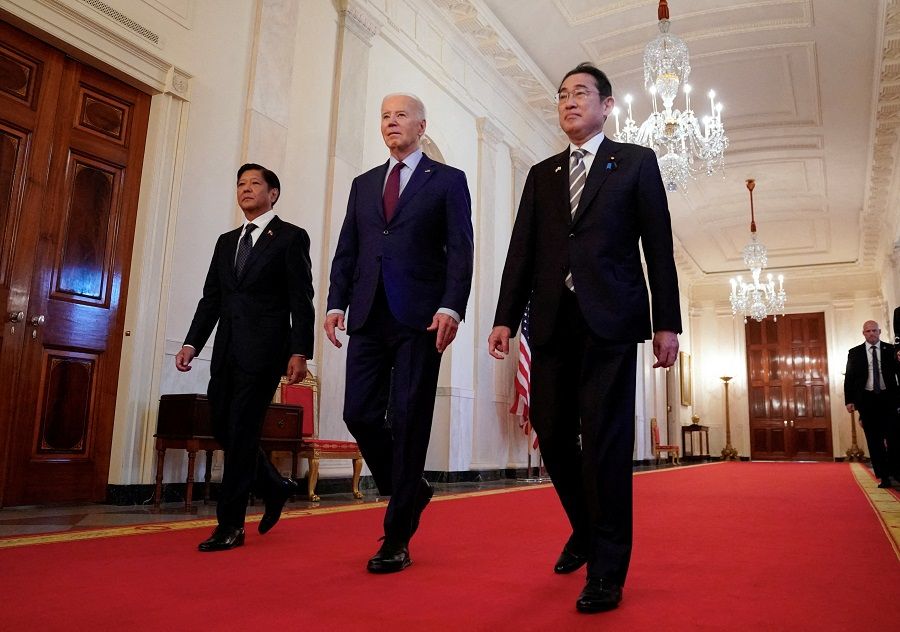 US President Joe Biden escorts Philippines President Ferdinand Marcos Jr. and Japan Prime Minister Fumio Kishida to their trilateral summit at the White House in Washington, US, on 11 April 2024. (Kevin Lamarque/Reuters)
