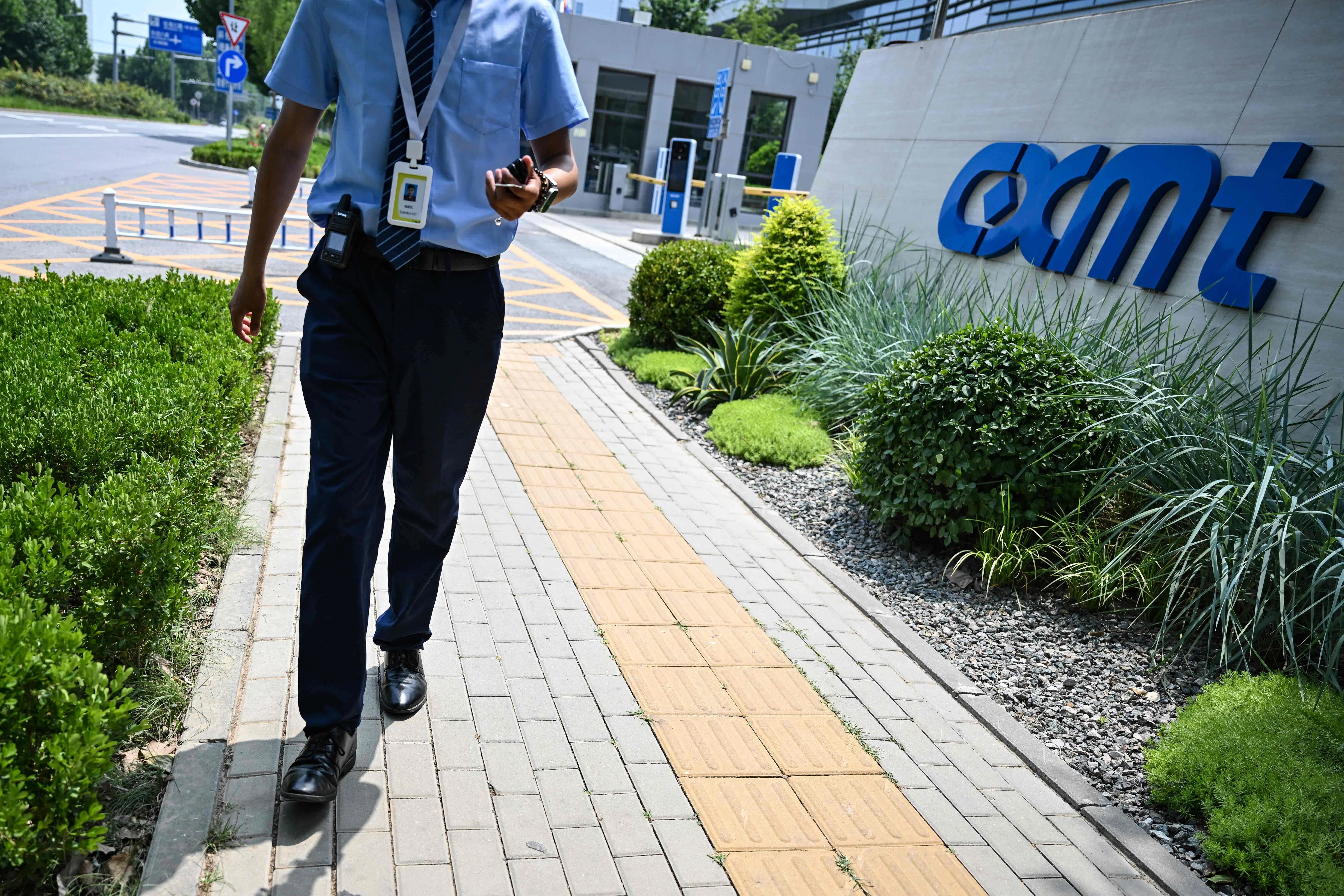 A security personnel walks at an entrance to the ChangXin Memory Technologies (CXMT) factory on the outskirts of Beijing on 27 July 2026.