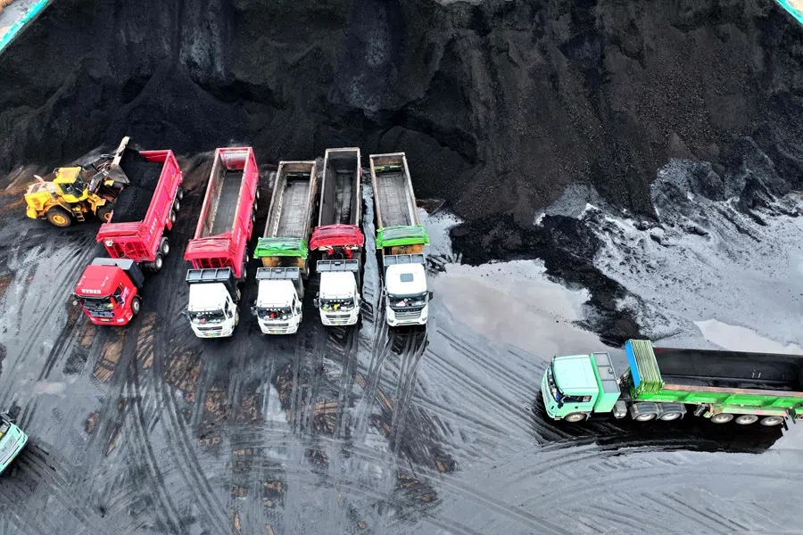 Coal used in power plants is loaded on to trucks at the coal storage facility at the port in Lianyungang, in China’s eastern Jiangsu province on 22 September 2025.