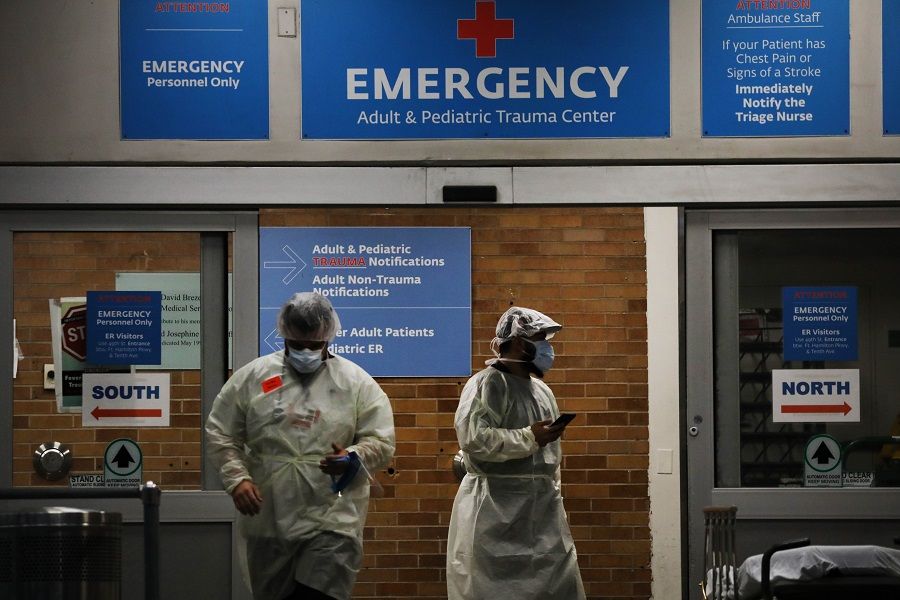 Medical workers take in patients outside a special coronavirus area at Maimonides Medical Center on 6 May 2020 in the Borough Park neighborhood of the Brooklyn borough of New York City. (Spencer Platt/Getty Images/AFP)