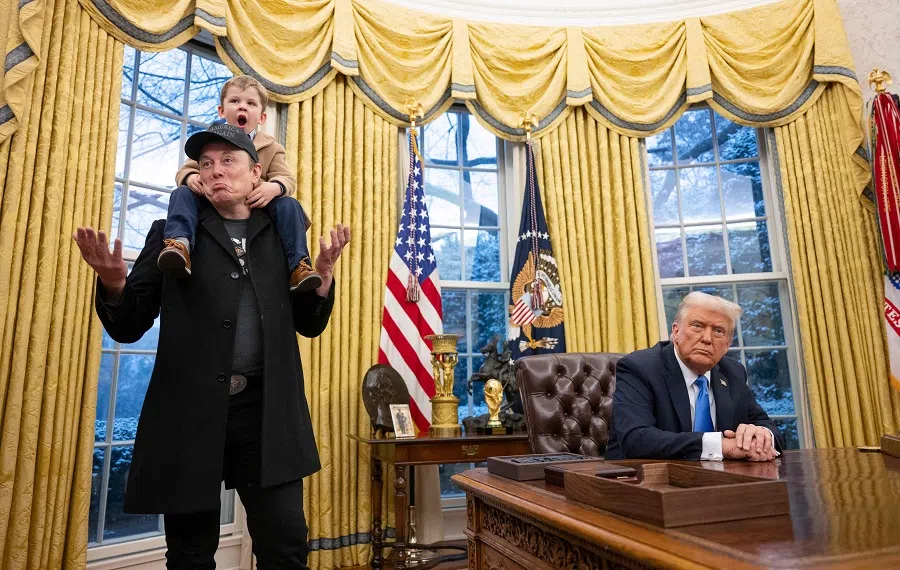 Tesla and SpaceX CEO Elon Musk with his son X Æ A-Xii join US President Donald Trump as he signs executive orders in the Oval Office of the White House in Washington, DC, US, on 11 February 2025. (Jim Watson/AFP)