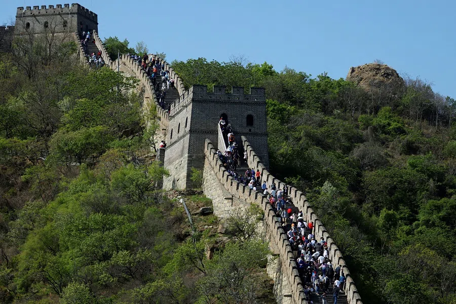People visit the Mutianyu section of the Great Wall of China, in Beijing, China, 2 May 2021. (Carlos Garcia Rawlins/Reuters)