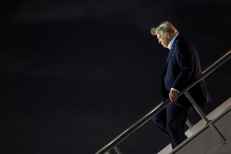 US President Donald Trump deboards the plane as he arrives at Miami International Airport in Miami, Florida, US, on 25 January 2025.