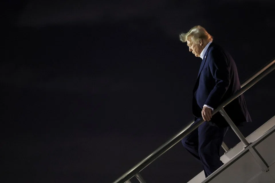 US President Donald Trump deboards the plane as he arrives at Miami International Airport in Miami, Florida, US, on 25 January 2025. (Leah Millis/Reuters)