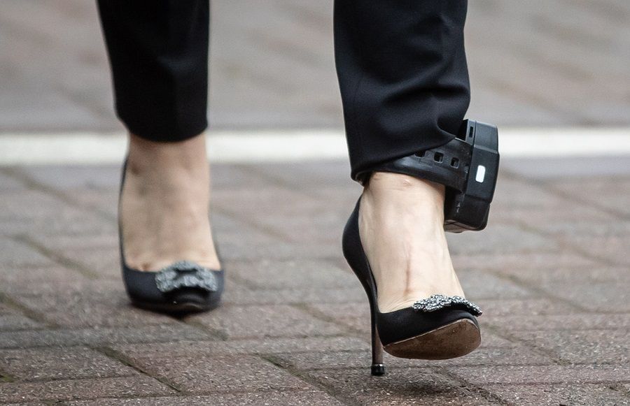 Huawei CFO Meng Wanzhou wears an ankle monitor while leaving her home to appear in Supreme Court for a hearing in Vancouver, British Columbia, Canada, 29 October 2020. (Darryl Dyck/Bloomberg)