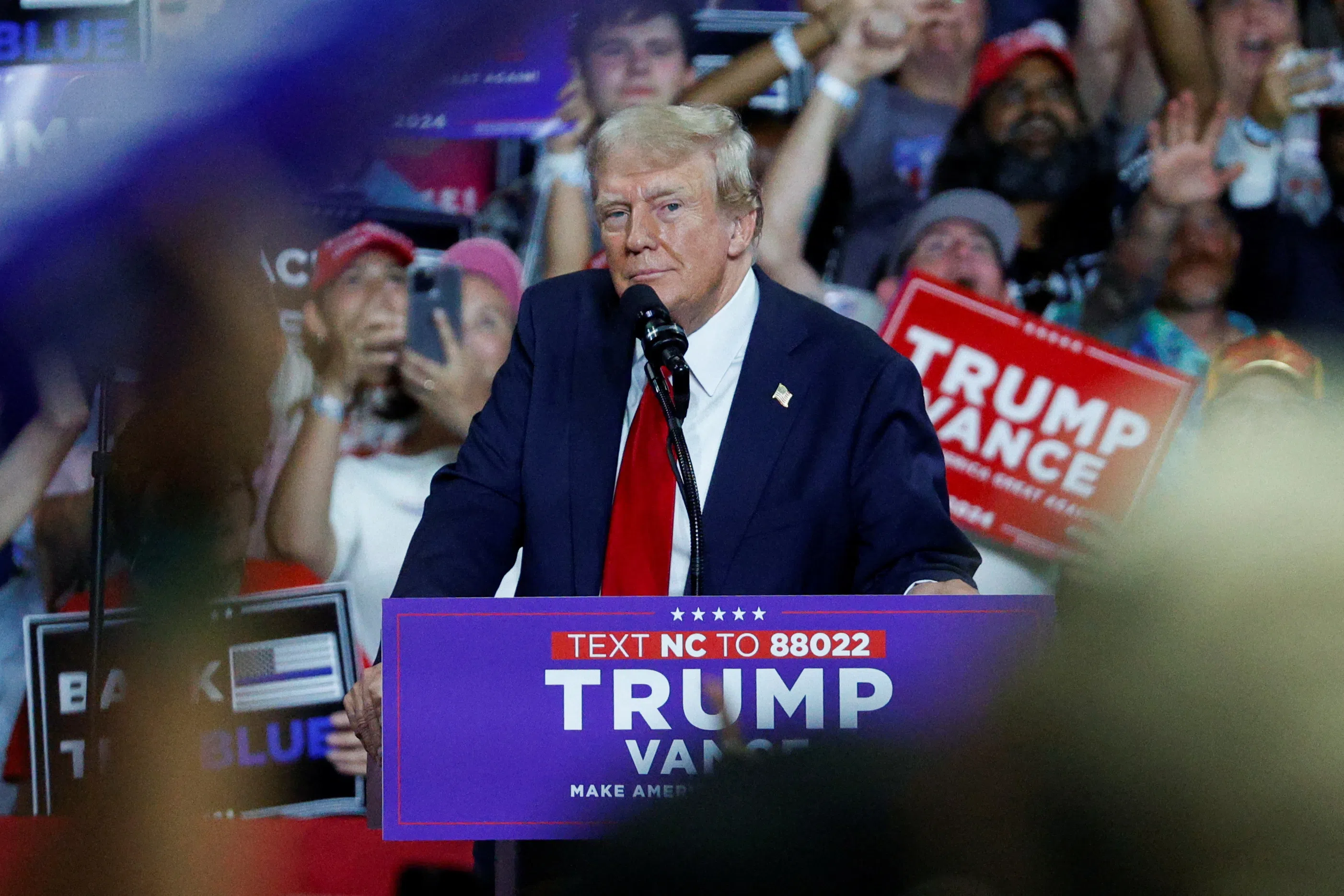Republican presidential nominee and former US President Donald Trump looks on as he campaigns in Charlotte, North Carolina, US, on 24 July 2024.