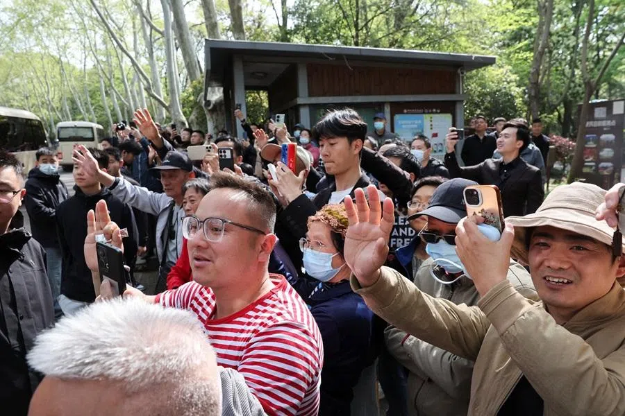 People wave at the motorcade of Cheng Li-wun, chairperson of Taiwan's opposition party, Kuomintang (KMT), on the day she visits Sun Yat-sen Mausoleum in Nanjing, China, on 8 April 2026. (Go Nakamura/Reuters)