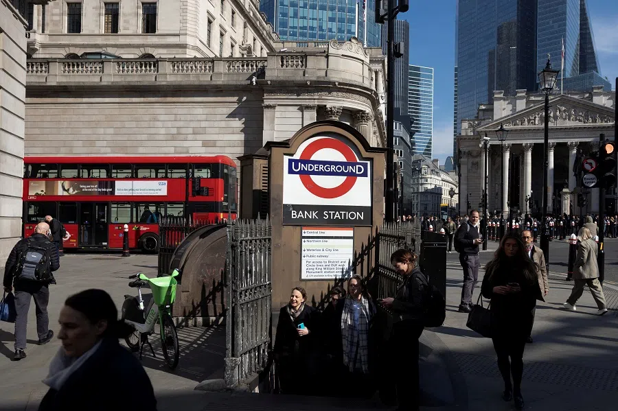 People walk in London, Britain, on 19 March 2025. (Carlos Jasso/Reuters)