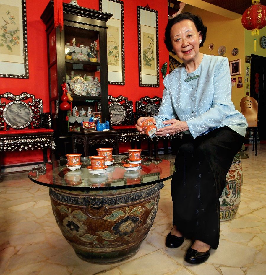 Madam Hoo Miew Oon, great-granddaughter of Hoo Ah Kay, better known as Whampoa, with some of the pots she has donated to the Singapore Botanic Gardens heritage museum. The old pots will take pride of place at the museum as they are cultural and historical artefacts that speak of Singapore's unique history. (SPH)