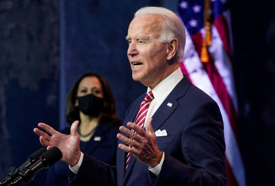 U.S. President-elect Joe Biden speaks as Vice President-elect Kamala Harris stands by in Wilmington, Delaware, U.S., 16 November 2020. (Kevin Lamarque/REUTERS)