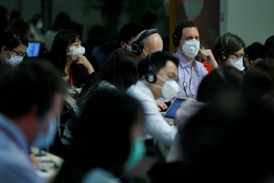 Journalists at the daily press briefing of the Chinese Foreign Ministry in Beijing, March 18, 2020. (Thomas Peter/REUTERS)