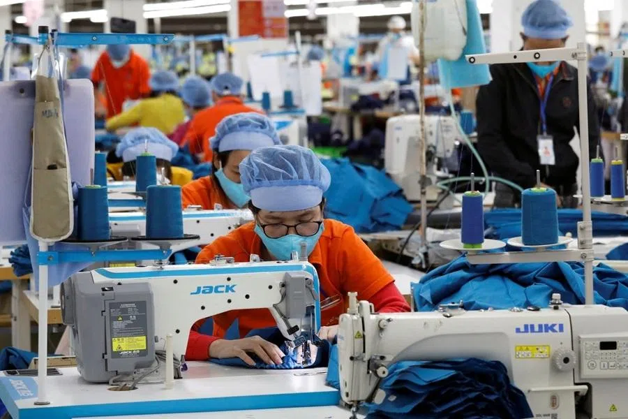 Labourers work at Hung Viet garment export factory in Hung Yen province, Vietnam, 30 December 2020. (Kham/Reuters)