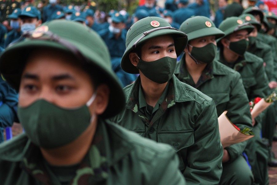 Vietnamese military new recruits at a ceremony before leaving for military service, in Hanoi, Vietnam, 27 February 2021. (Thanh Hue/Reuters)