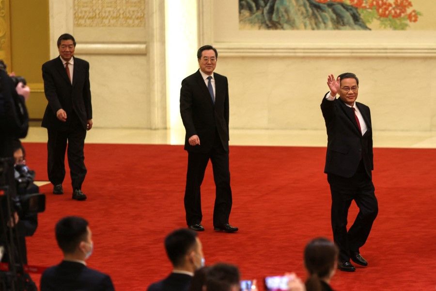 Chinese Premier Li Qiang, alongside Chinese Vice Premiers Ding Xuexiang and He Lifeng, attends a news conference following the closing session of the National People's Congress, at the Great Hall of the People, in Beijing, China, 13 March 13, 2023. (Florence Lo/Reuters)