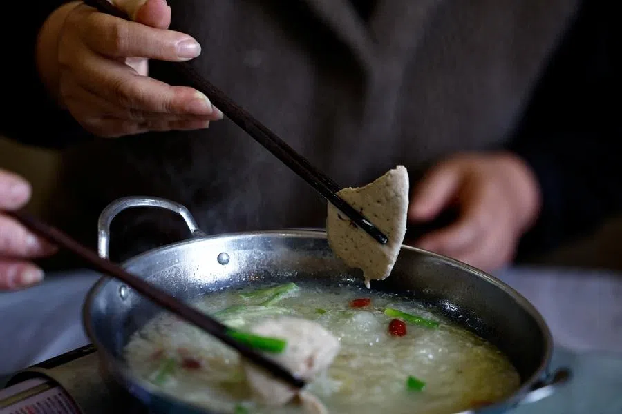 A restaurant owner eats foie gras hotpot in Huoqiu county, Anhui province, China, on 28 April 2026.