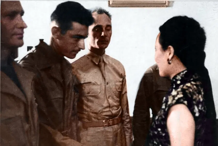 Madame Chiang in a warm exchange with pilots in the Doolittle Raid.
