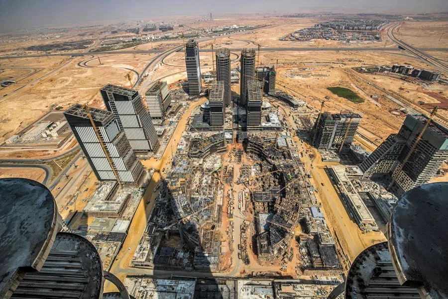 This photo, taken on 3 August 2021 from the “Iconic Tower” skyscraper, shows a view of construction work ongoing at the “business and finance district” of Egypt’s “New Administrative Capital” megaproject, some 45 kilometres east of Cairo. (Khaled Desouki/AFP)