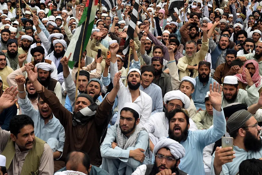 Activists and supporters of Jamiat Ulema-e-Islam (F) party shout slogans as they take part in a protest in Quetta, the capital of Balochistan province in Pakistan, on 2 August 2024, against the assassination of Hamas chief Ismail Haniyeh in an air strike in Tehran. (Banaras Khan/AFP)