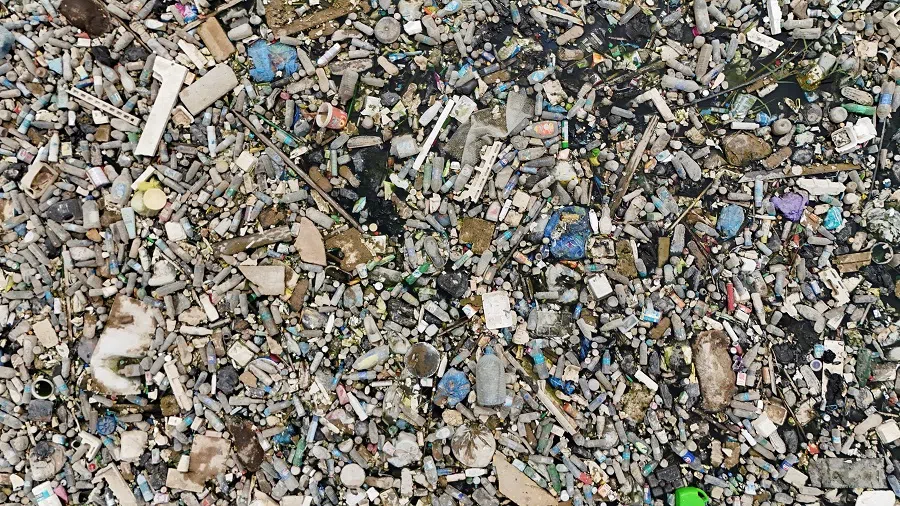 A drone view shows Al-Ashar River, filled with sewage and trash, running through Basra, Iraq, on 29 April 2025. (Mohammed Aty/Reuters)