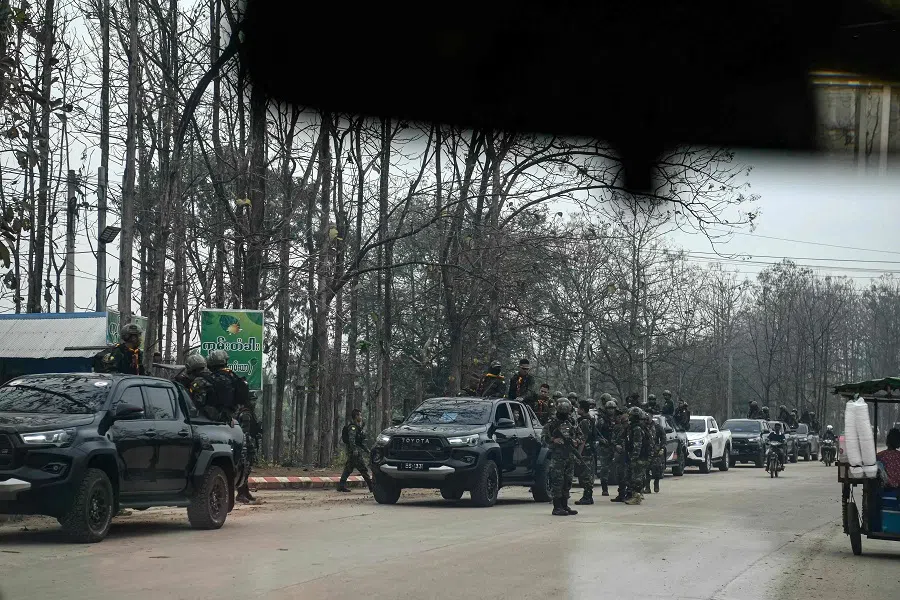 In this photo taken on 24 February 2025 members of the Karen Border Guard Force (BGF) take part in a crackdown operation on illicit activity linked to scam centres in Myanmar’s eastern Myawaddy township. Hundreds of foreigners are being sent home from scam compounds in Myanmar that are run by criminal gangs, with many workers saying they were trafficked and forced to swindle people around the world in protracted internet scams. (AFP)