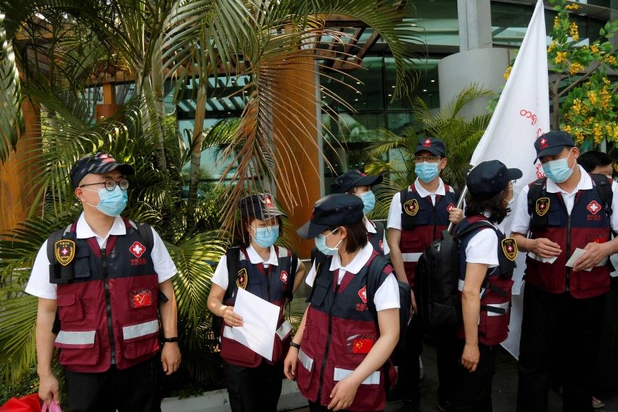 A Chinese medical team arrives at Yangon International Airport in Yangon, 8 April 2020 to aid Myanmar in its effort to combat the coronavirus. (Sai Aung Main/AFP)
