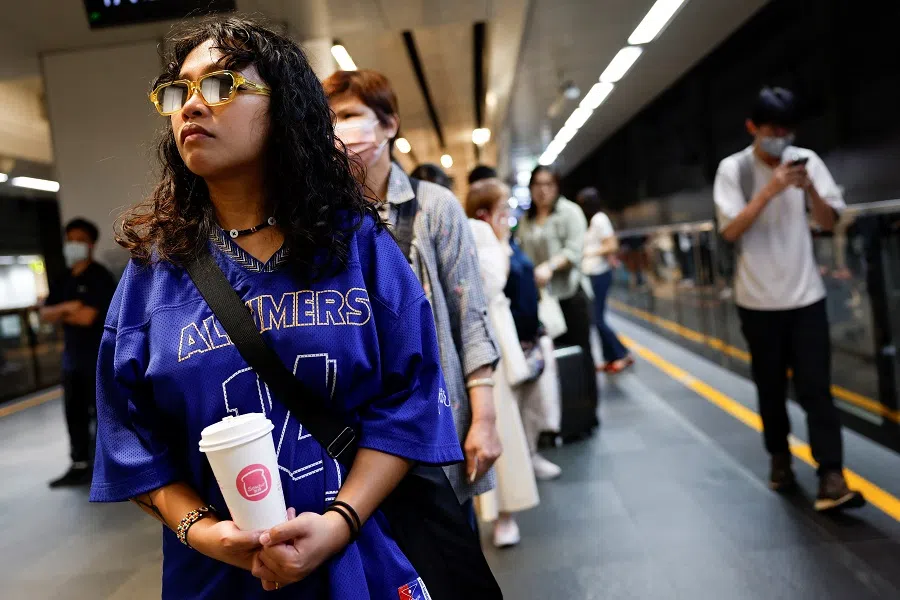 People wait for the arrival of a train at a platform of Taipei Main Station in Taipei, Taiwan, on 23 May 2024. 