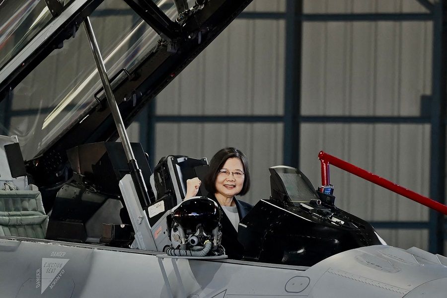Taiwan President Tsai Ing-wen gestures from an upgraded US-made F-16V fighter during a ceremony at the Chiayi Air Base in Taiwan on 18 November 2021. (Sam Yeh/AFP)