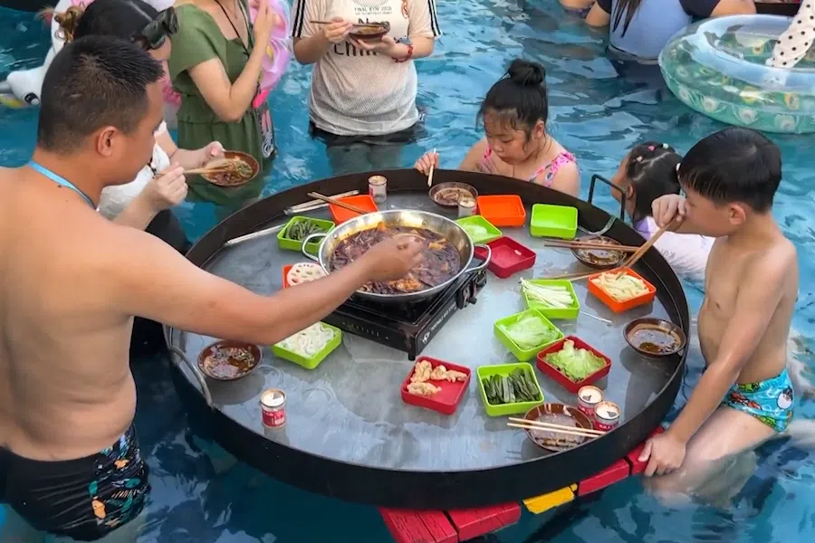 A family enjoys hotpot at a water park in Meixin Wine Town, Chongqing, China.