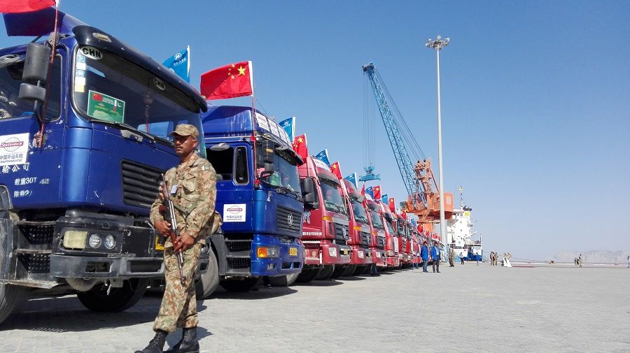 Chinese trucks parked at Gwadar port. These trucks were part of the trade convoy that carried the first export consignment from Kashgar to Gwadar for onward shipment on 13 November 2016. (Khurram Husain/Dawn)