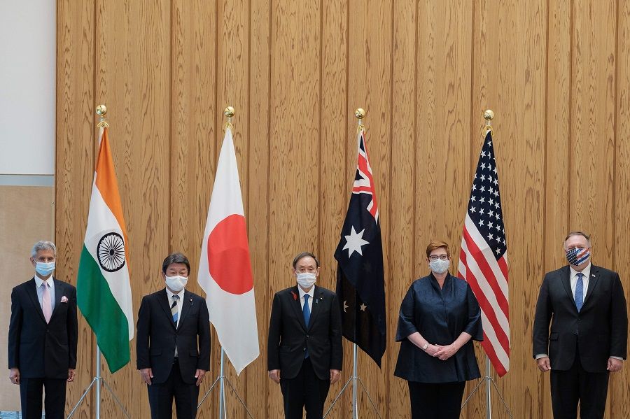 (left to right) India's Foreign Minister Subrahmanyam Jaishankar, Japan's Foreign Minister Toshimitsu Motegi, Japan's Prime Minister Yoshihide Suga, Australia's Foreign Minister Marise Payne and US Secretary of State Mike Pompeo pose for photographs before a Quad Indo-Pacific meeting at the prime minister's office in Tokyo on 6 October 2020. (Nicolas Datiche/POOL/AFP)