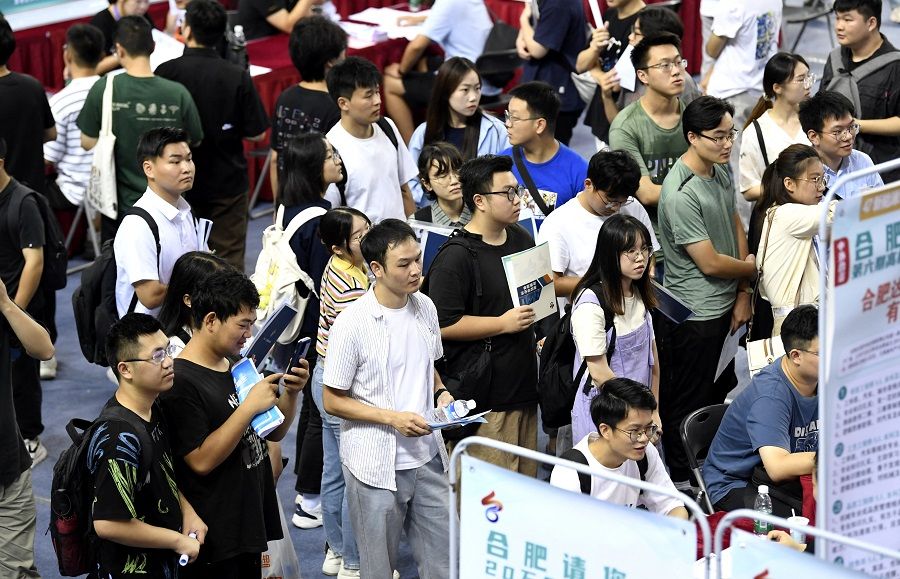 People attend a job fair for university graduates at a gymnasium in Hefei, Anhui province, China, on 4 September 2023. (China Daily via Reuters)