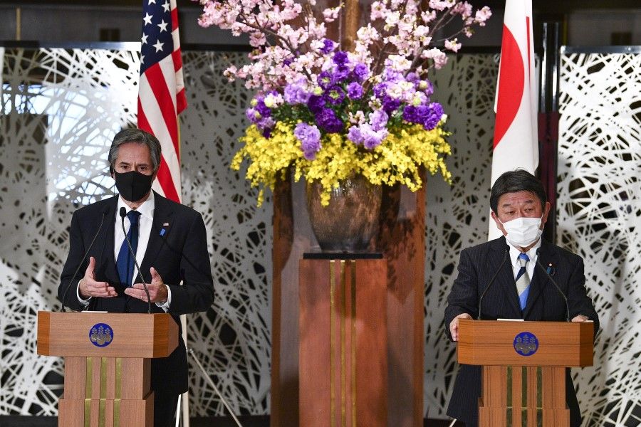 US Secretary of State Antony Blinken (left) and Japanese Foreign Minister Toshimitsu Motegi attend a joint news conference in Tokyo, Japan, 16 March 2021. (Kazuhiro Nogi/AFP/Bloomberg)