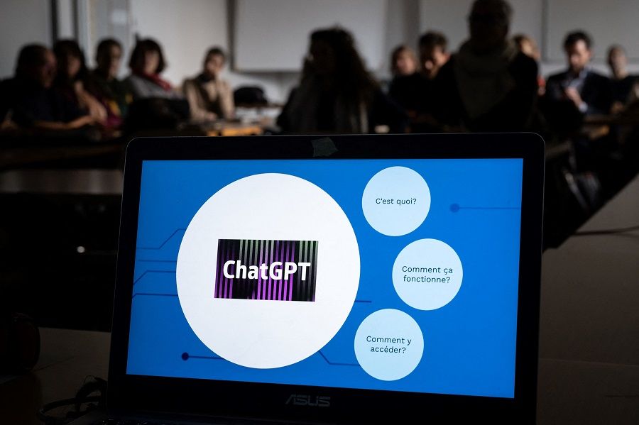 Teachers are seen behind a laptop during a workshop on ChatGPT organised by the School Media Service (SEM) of the Public education of the Swiss canton of Geneva, on 1 February 2023. (Fabrice Coffrini/AFP)