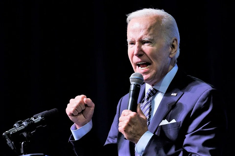 US President Joe Biden gestures as he delivers remarks at a reception for the Democratic National Committee in National Harbor, Maryland, US, 8 September 2022. (Evelyn Hockstein/Reuters)