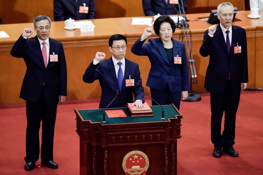 This file photo taken on 19 March 2018 shows China's newly elected Vice Premier Sun Chunlan (second from right) taking an oath after being elected during the seventh plenary session of the first session of the 13th National People's Congress (NPC) at the Great Hall of the People in Beijing, China. (Fred Dufour/AFP)