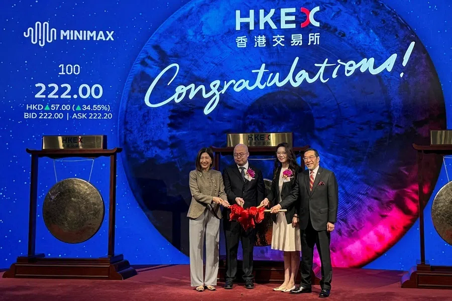 MiniMax founder and CEO Yan Junjie (second left) and COO Yun Yeyi (second right) pose with Hong Kong Stock Exchange CEO Bonnie Chan (left) and chairman Carlson Tong at the Chinese artificial intelligence model developer's listing ceremony at the Hong Kong Stock Exchange, in Hong Kong, China, on 9 January 2026.
