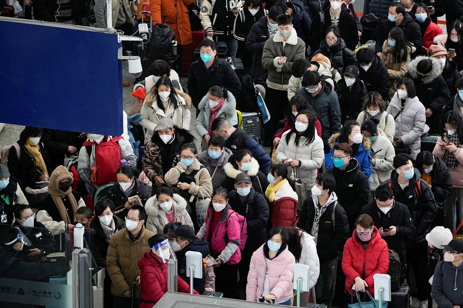Passengers wait to board trains at Shanghai's Hongqiao Railway Station during the annual Spring Festival travel rush ahead of the Chinese Lunar New Year in Shanghai, China, 18 January 2023. (Aly Song/Reuters)