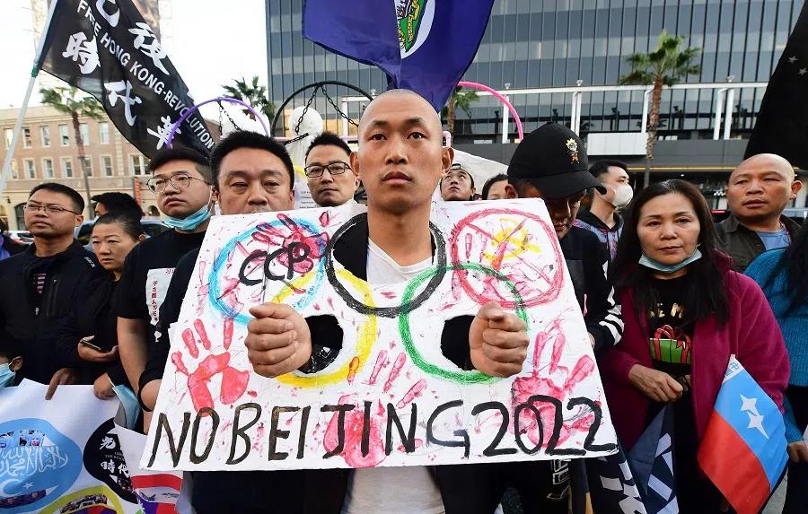 Activists from the China Democracy Party hold a "No Rights No Games" rally on International Human Rights Day in Hollywood, California, on 10 December 2021. (Frederic J. Brown/AFP)