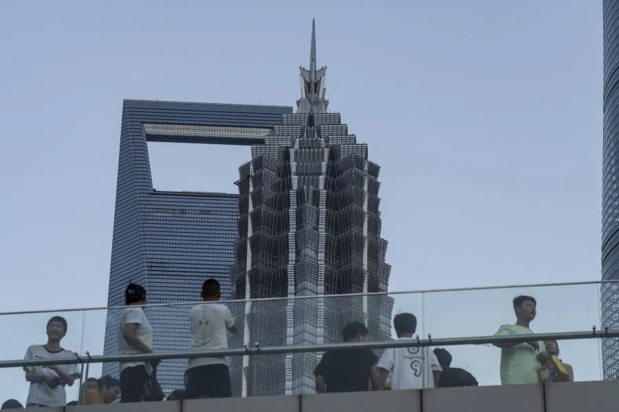 Pedestrians in Pudong’s Lujiazui Financial District in Shanghai, China, 7 August 2024. (Qilai Shen/Bloomberg)