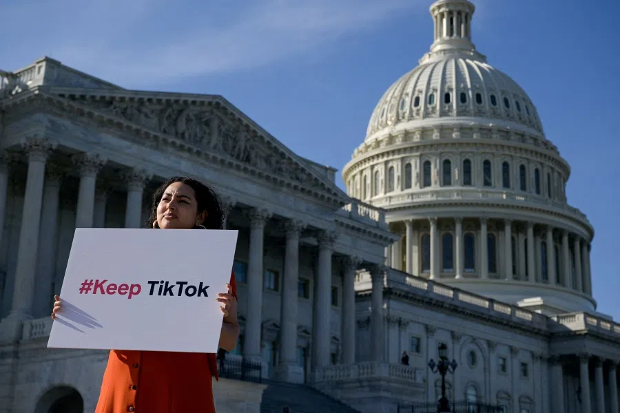 A demonstrator outside the US Capitol following a press conference by TikTok creators to voice their opposition to the “Protecting Americans from Foreign Adversary Controlled Applications Act”, pending crackdown legislation on TikTok in the House of Representatives, on Capitol Hill in Washington, US, on 12 March 2024.