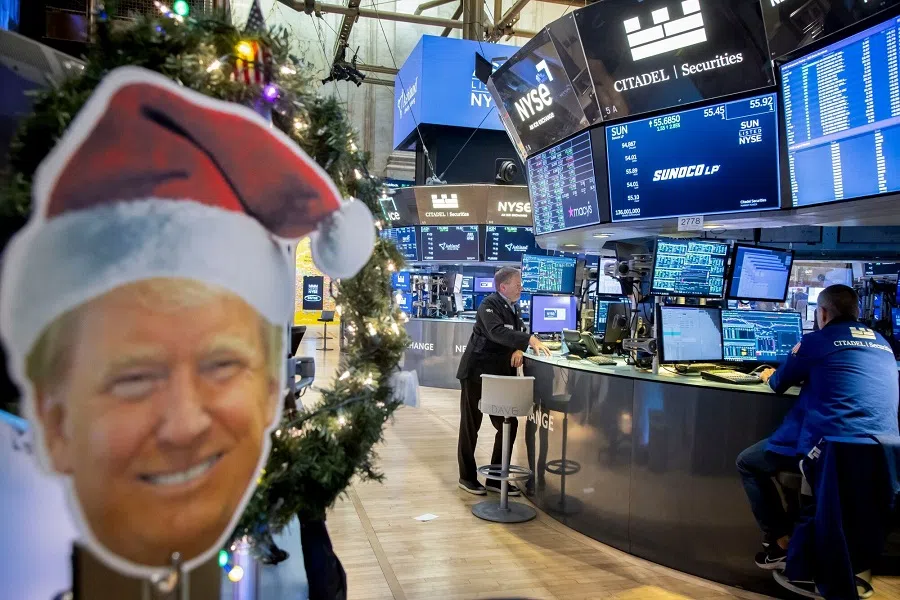 A cutout image of US President-elect Donald Trump wearing a Santa hat on the floor of the New York Stock Exchange (NYSE) in New York, US, on 9 December 2024. (Michael Nagle/Bloomberg)