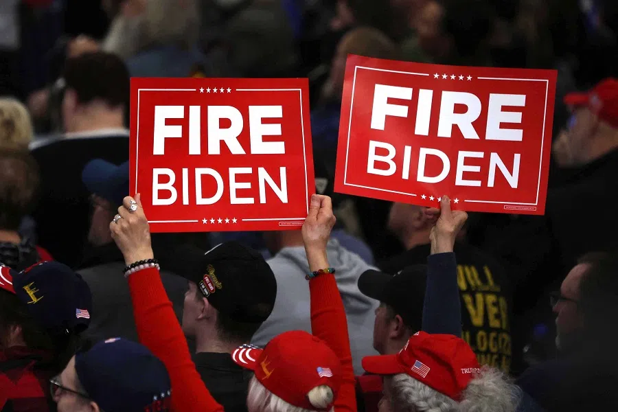 Supporters hold up signs as former US President and 2024 presidential hopeful Donald Trump speaks during a campaign rally in Green Bay, Wisconsin, on 2 April 2024. (Alex Wroblewski/AFP)