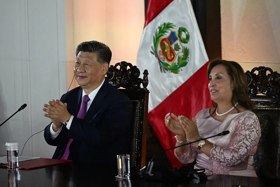 China’s President Xi Jinping and Peru’s President Dina Boluarte applaud during the virtual inauguration ceremony of the Chancay “megaport” on 14 November 2024. (Ernesto Benavides/AFP)