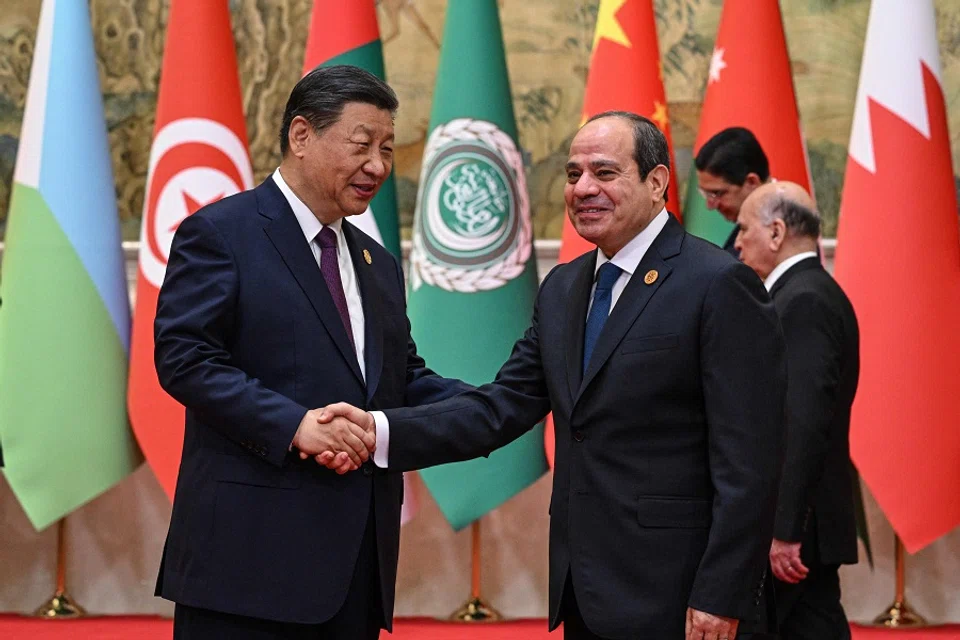 China’s President Xi Jinping (left) shakes hands with Egypt’s President Abdel Fattah el-Sissi before the opening ceremony of the 10th Ministerial Meeting of China-Arab States Cooperation Forum at the Diaoyutai State Guesthouse in Beijing, China, on 30 May 2024. (Jade Gao/Pool/AFP)